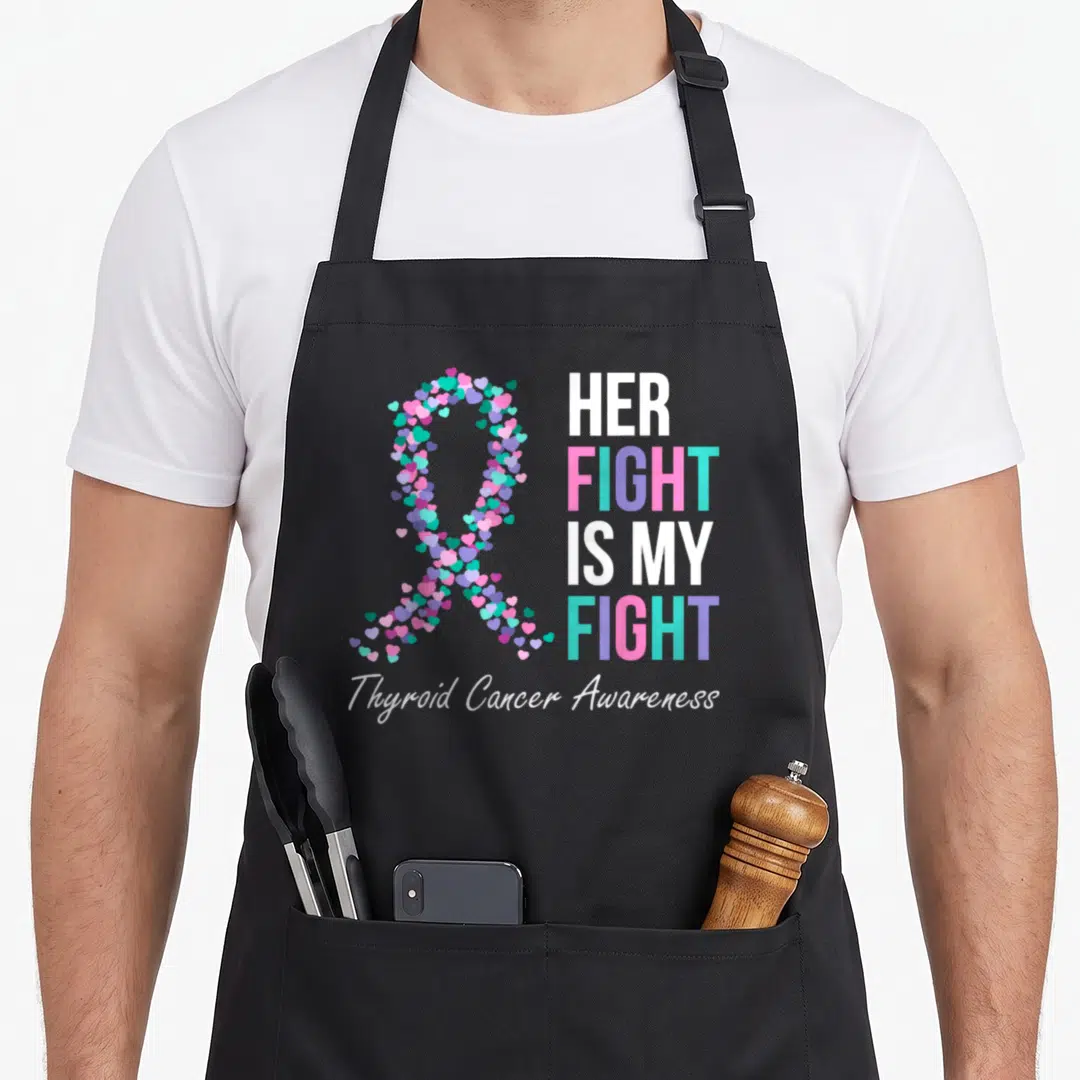 Thyroid cancer family aprons - Heart-shaped awareness ribbon in pink purple teal and white next to stacked bold text — shown on a black cotton canvas apron against a white background