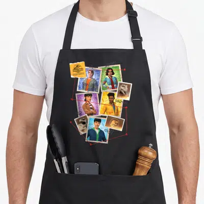 Chao jurassic world apron - Conspiracy board with Ben Sammy Darius Yaz Kenji photos connected by red string and pins — shown on a black cotton canvas apron against a white background