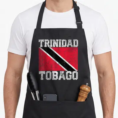 Trinidad country apron - Distressed red black and white Trinidad Tobago flag with white text — shown on a black cotton canvas apron against a white background