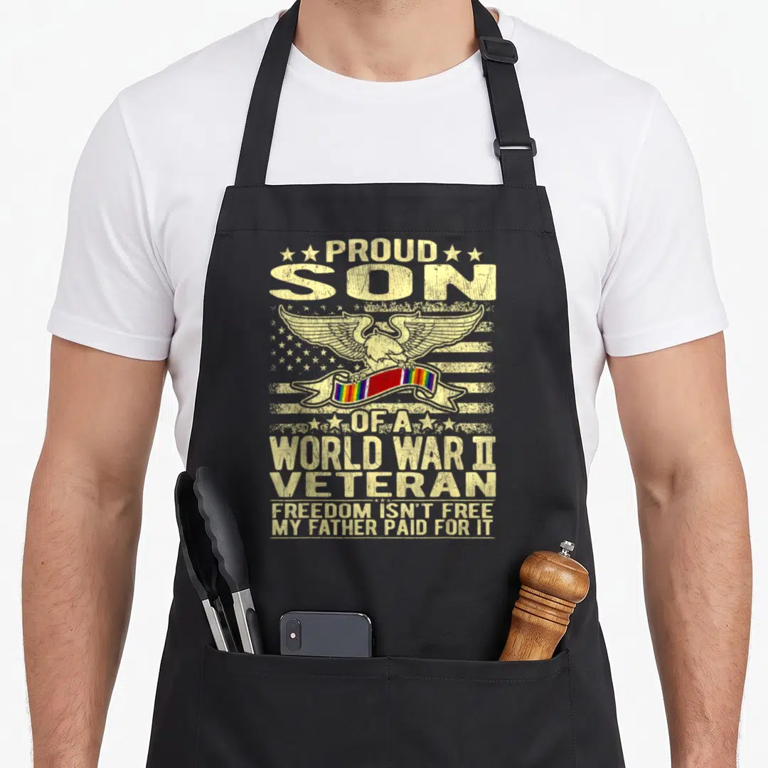 Freedom ww2 apron - Distressed eagle over stars stripes with rainbow ribbon and WW2 veteran tribute text — shown on a black cotton canvas apron against a white background