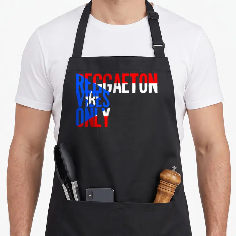 Funny reggaeton apron - Red blue and white stacked text reading REGGAETON VIBES ONLY — shown on a black cotton canvas apron against a white background