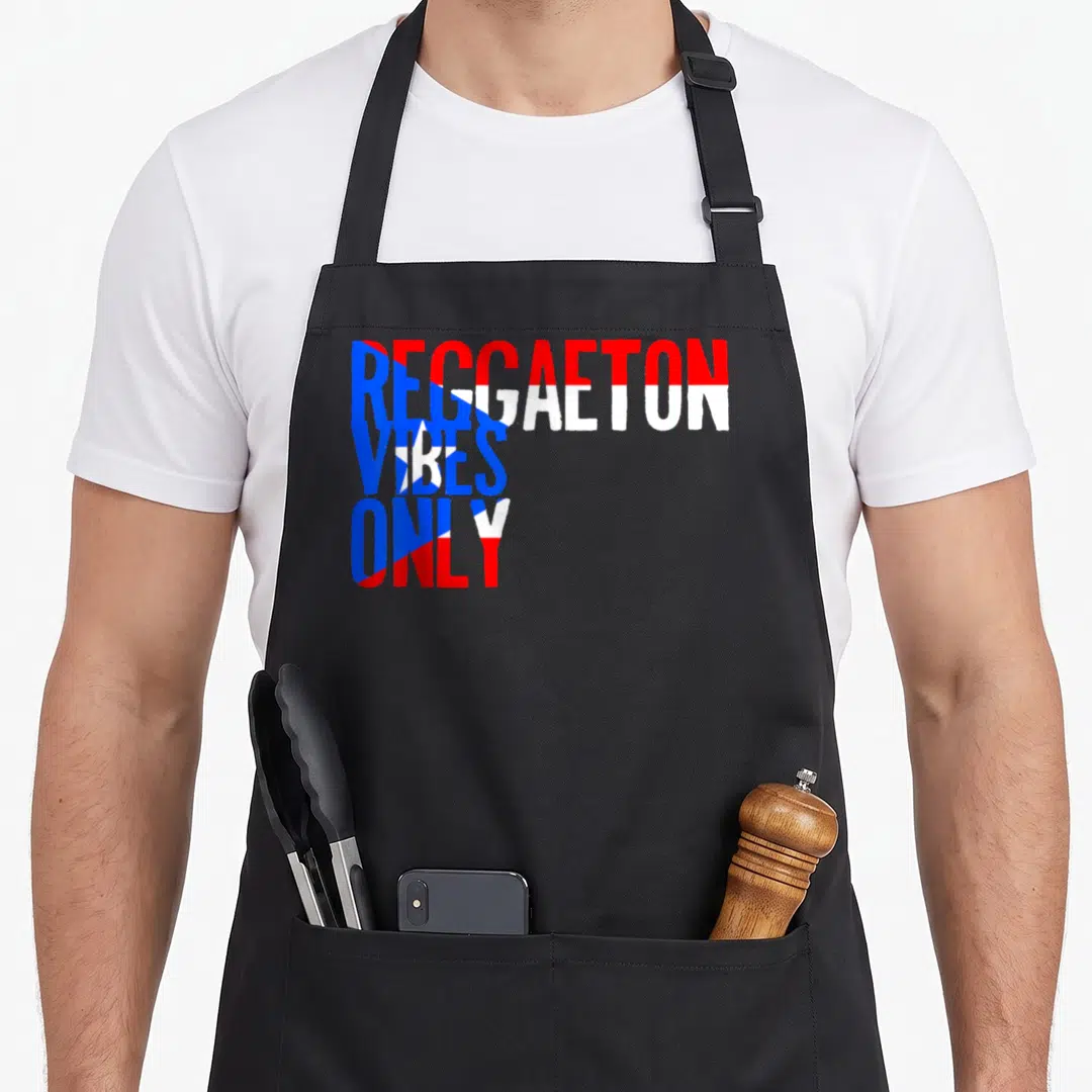Funny reggaeton apron - Red blue and white stacked text reading REGGAETON VIBES ONLY — shown on a black cotton canvas apron against a white background