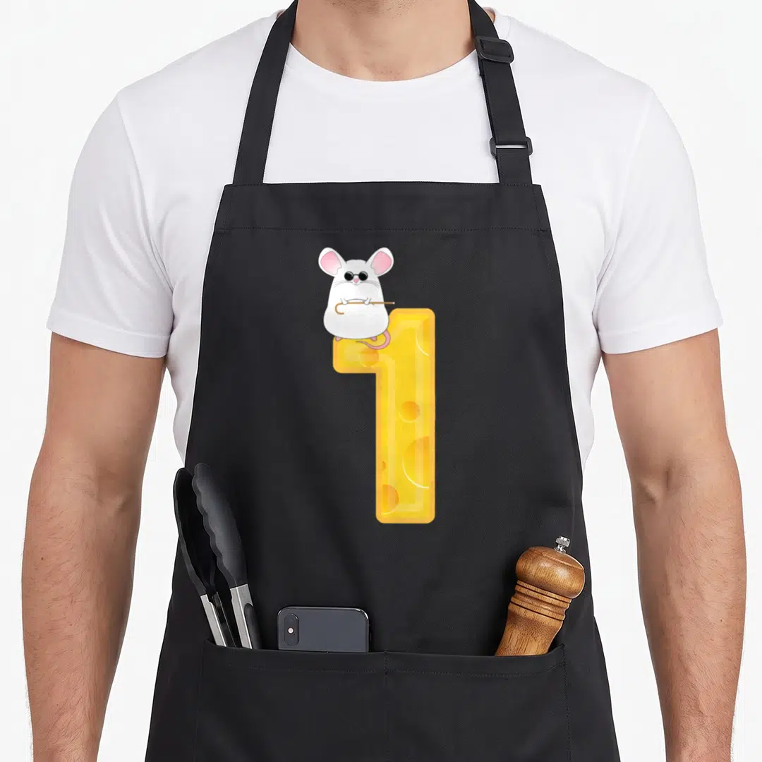 Mouse halloween apron - White mouse with sunglasses holding cane on yellow cheese number one — shown on a black cotton canvas apron against a white background