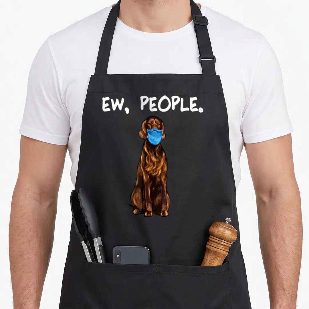 Irish dog face apron - Brown cartoon dog in blue mask with ew people text above — shown on a black cotton canvas apron against a white background