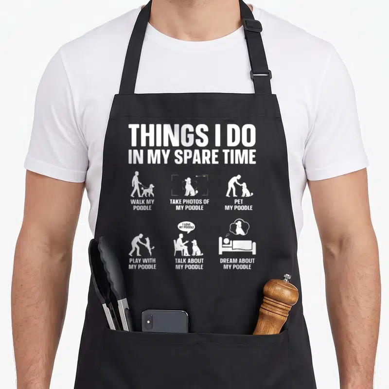 Funny dog standard size of apron - White poodle silhouette scenes with captions on black bib apron — shown on a black cotton canvas apron against a white background