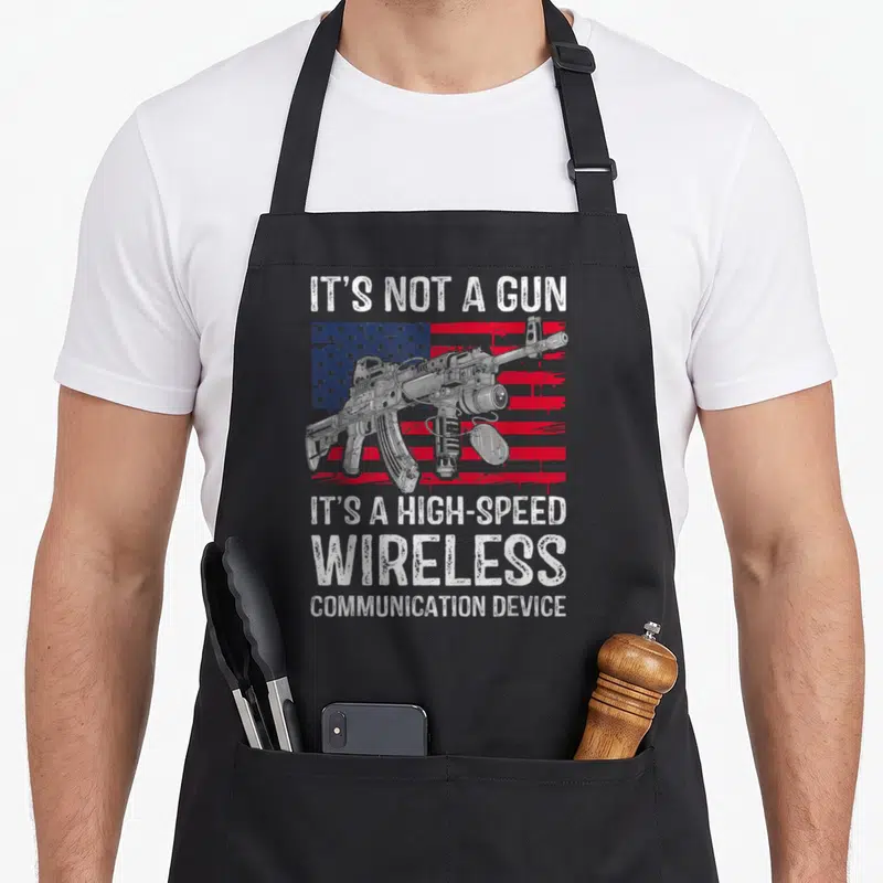Wireless gun apron - Sarcastic gun rights quote over distressed flag with rifle illustration in red white and grey — shown on a black cotton canvas apron against a white background