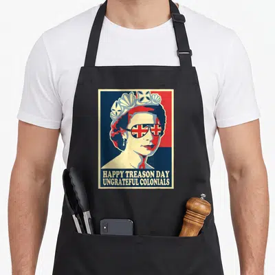 Treason colonial 4th of july apron - Queen Elizabeth II portrait with sunglasses and text Happy Treason Day Ungrateful — shown on a black cotton canvas apron against a white background