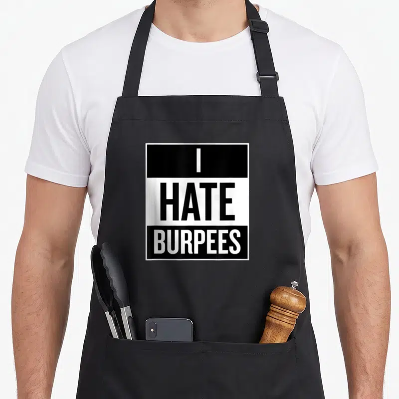Hate fitness burpees apron - Black and white stacked text reading I HATE BURPEES in three horizontal bands — shown on a black cotton canvas apron against a white background