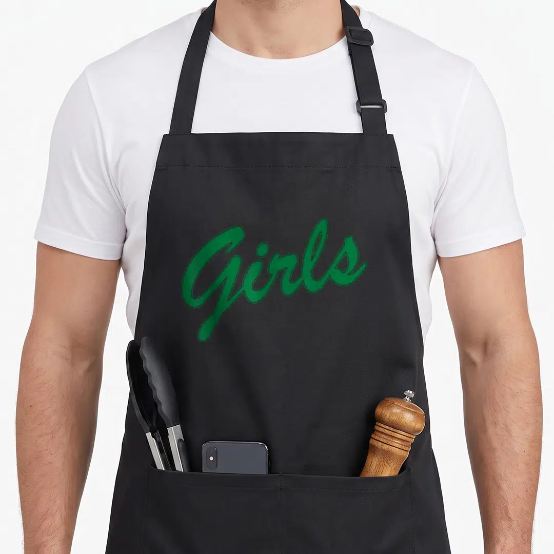 Funny rachel green apron - Green script text reading Girls on a grey background — shown on a black cotton canvas apron against a white background