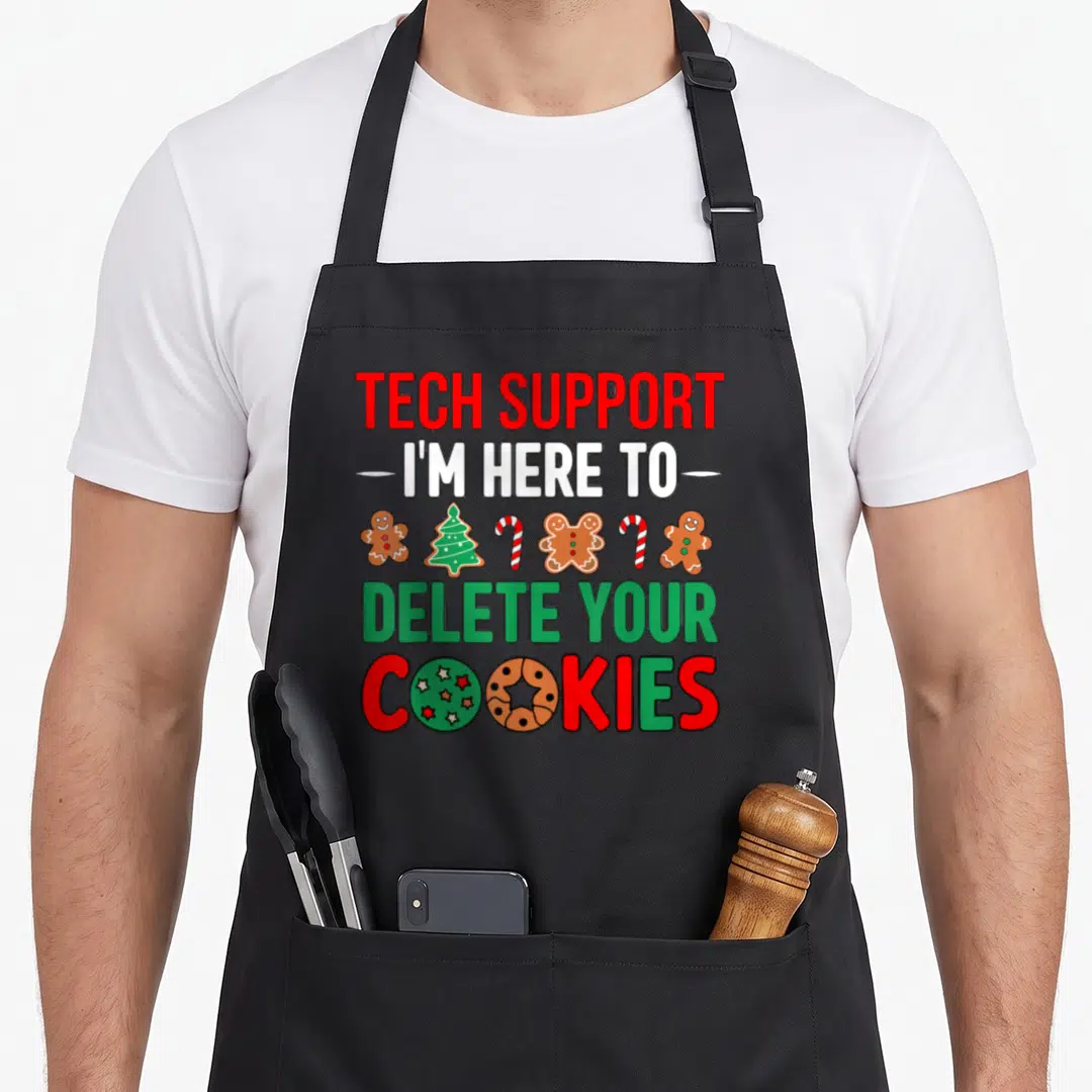 Support women's christmas aprons - Tech Support Delete Your Cookies text with gingerbread men candy canes and Christmas — shown on a black cotton canvas apron against a white background