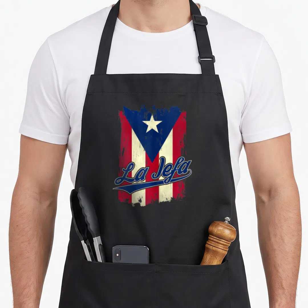 Jefa puerto rican apron - Distressed Puerto Rican flag with blue La Jefa script overlay — shown on a black cotton canvas apron against a white background
