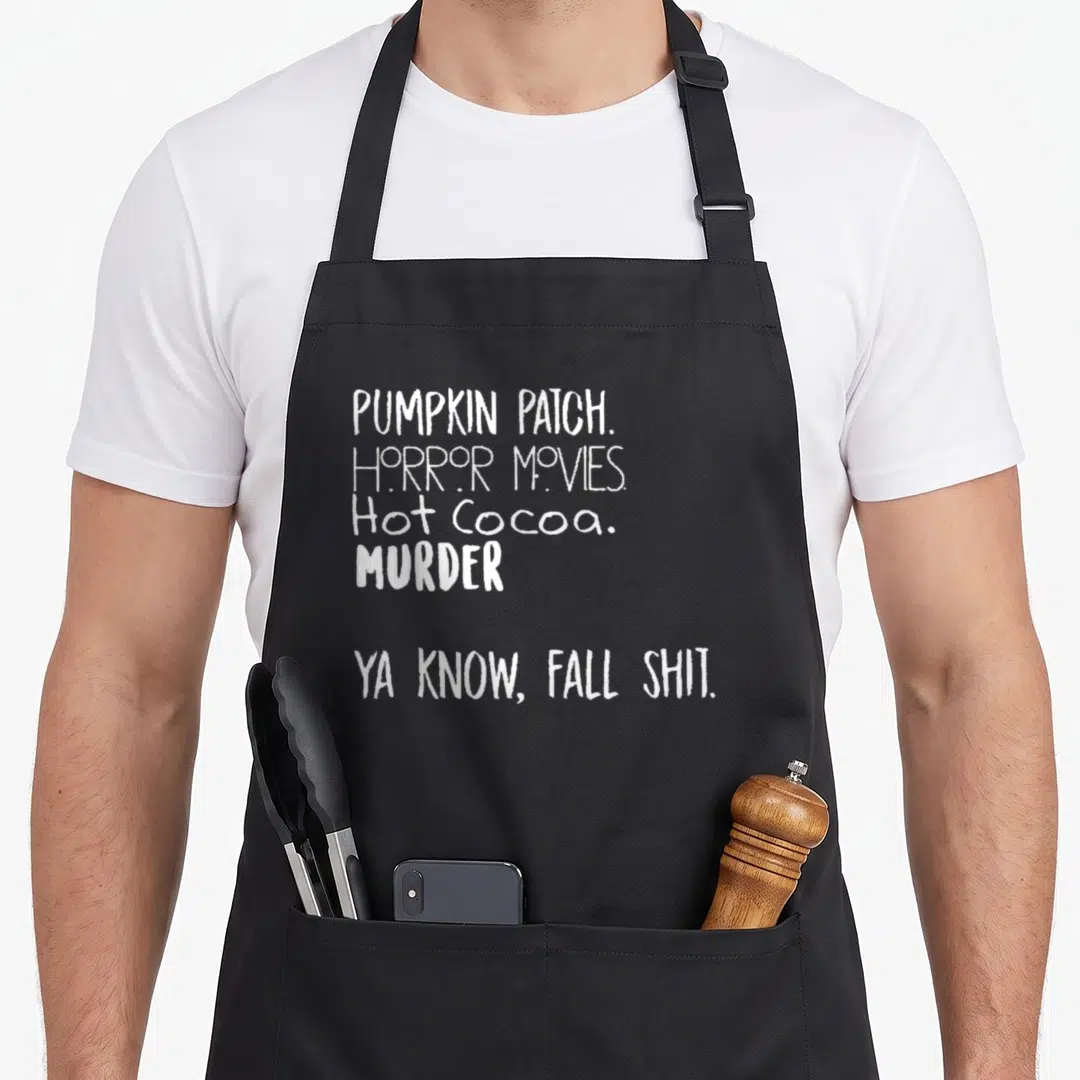 Pumpkin horror movie apron - White stacked text reading Pumpkin Patch Horror Movies Hot Cocoa Murder Fall Shit — shown on a black cotton canvas apron against a white background