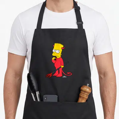 Bart halloween apron - Bart Simpson in red devil suit holding pitchfork with Matt Groening signature — shown on a black cotton canvas apron against a white background