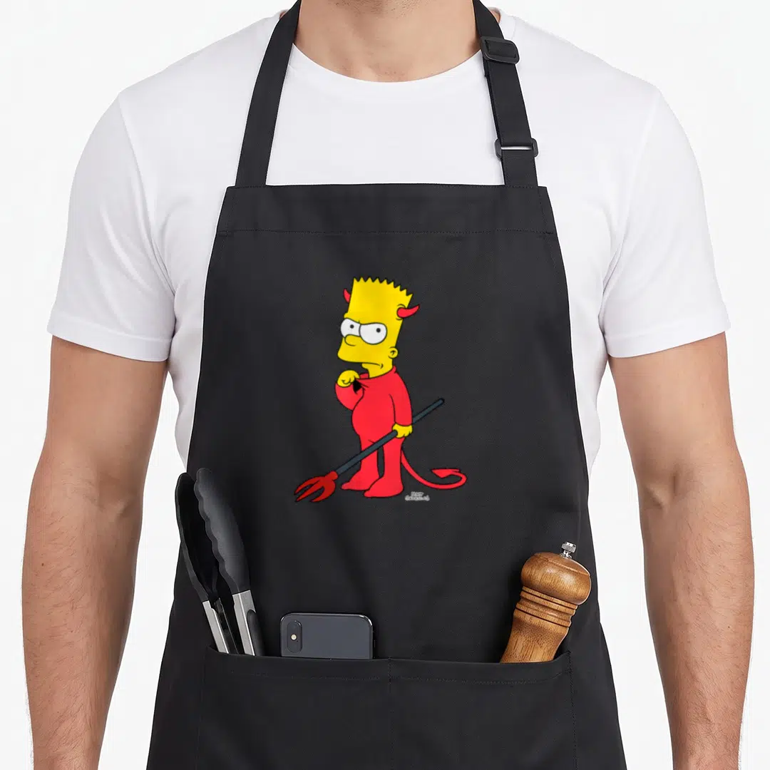 Bart halloween apron - Bart Simpson in red devil suit holding pitchfork with Matt Groening signature — shown on a black cotton canvas apron against a white background