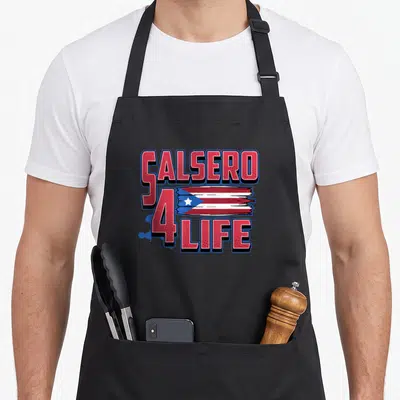 Salsero salsa pride apron - CALSERO 4 LIFE text with red white blue brush stroke flag between lines — shown on a black cotton canvas apron against a white background
