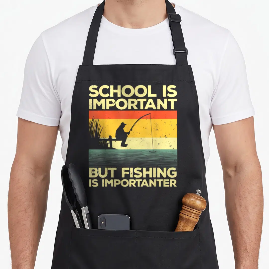 Bass fisherman fishing aprons - Retro striped sunset with fisherman silhouette and pun text about school and fishing — shown on a black cotton canvas apron against a white background