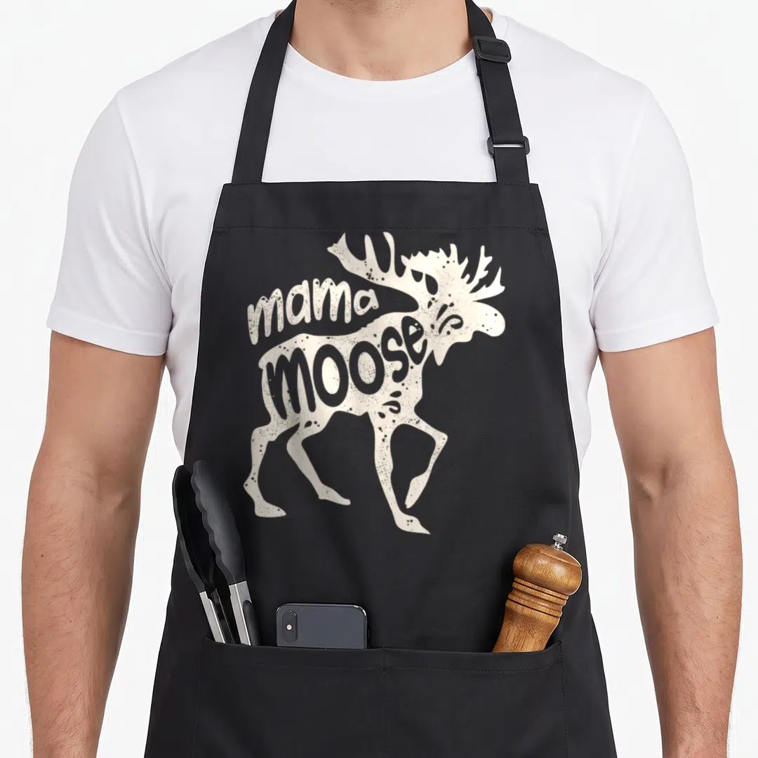 Moose mother's day aprons - Beige moose silhouette with integrated mama moose text on black background — shown on a black cotton canvas apron against a white background