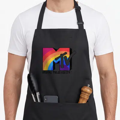 Mtv rainbow apron - Distressed MTV logo with rainbow gradient and Music Television text below — shown on a black cotton canvas apron against a white background