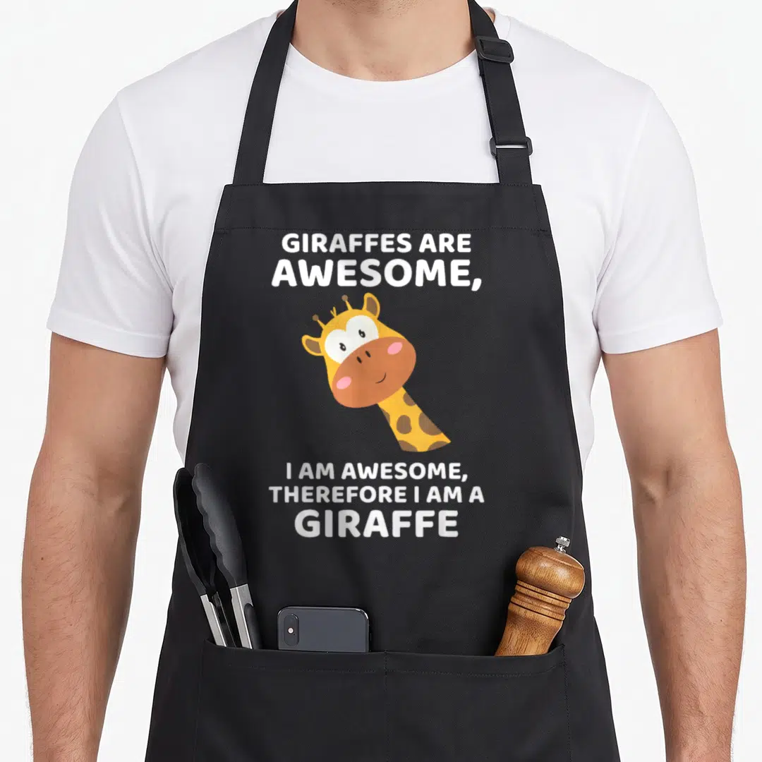 Therefore giraffe apron - Cartoon giraffe head between blocks of white text about being awesome — shown on a black cotton canvas apron against a white background