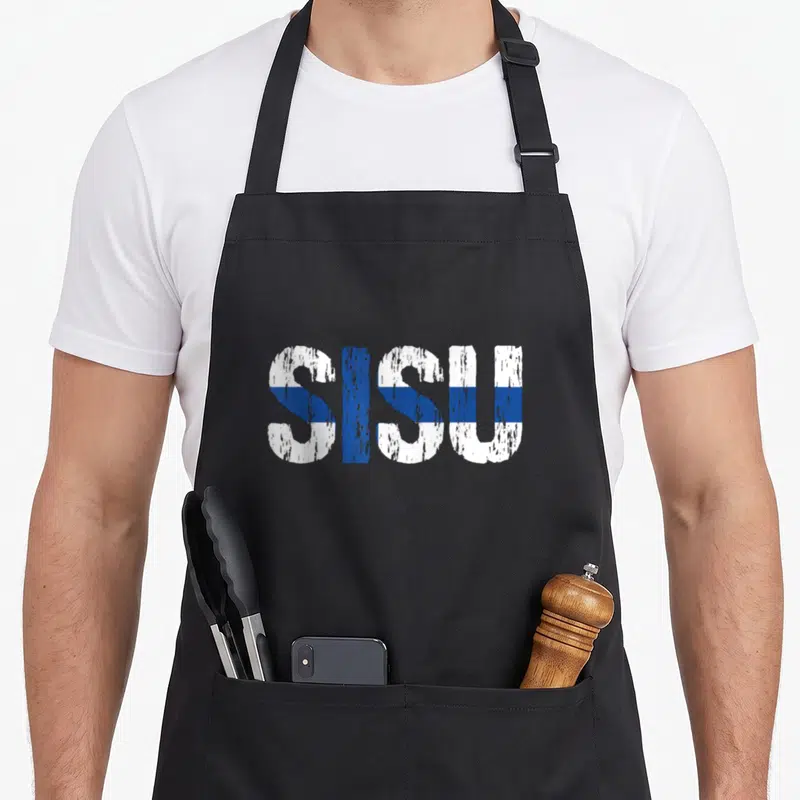 Finnish distressed apron - SISU text in white and blue distressed font resembling a flag pattern — shown on a black cotton canvas apron against a white background