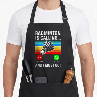 Badminton pickleball apron - Retro shuttlecock over colored stripes with red decline and green accept phone buttons — shown on a black cotton canvas apron against a white background