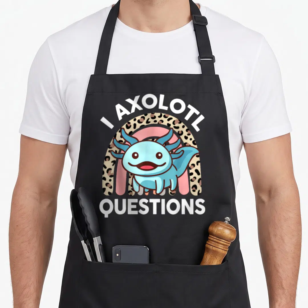 Question cute axolotl apron - Blue cartoon axolotl in front of a tan spotted rainbow with white text — shown on a black cotton canvas apron against a white background