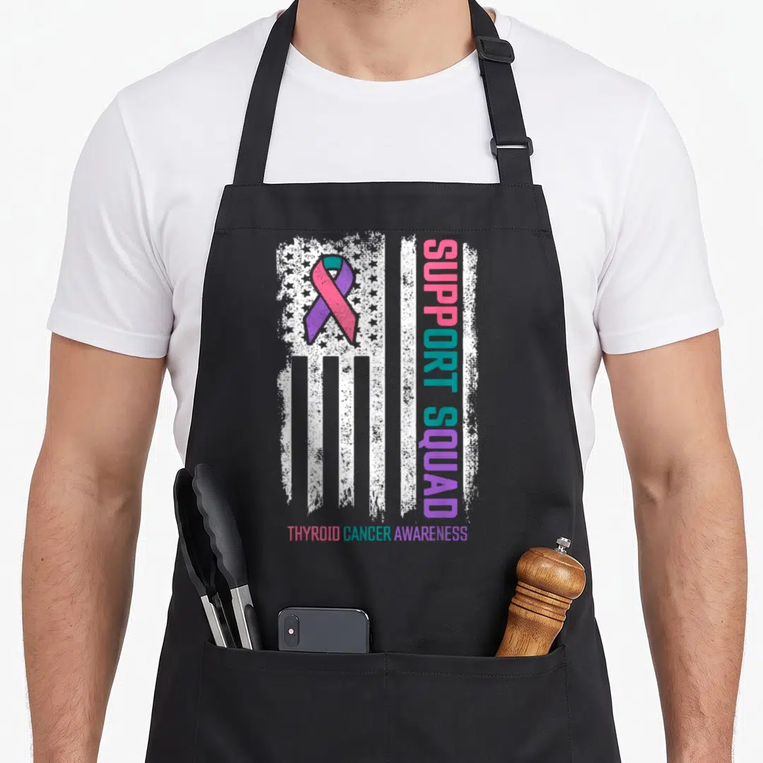 Cancer support thyroid apron - Distressed white flag with purple pink ribbon and vertical SUPPORT SQUAD text — shown on a black cotton canvas apron against a white background