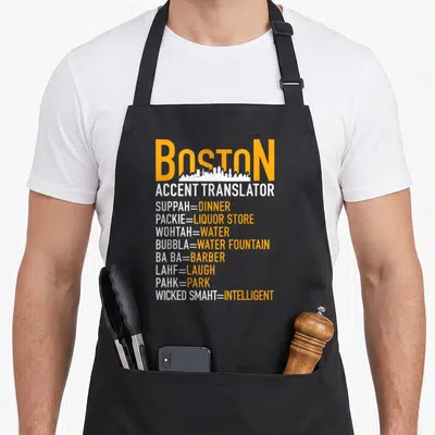 Boston wicked apron - Orange and white Boston accent translator text with white skyline silhouette on black background — shown on a black cotton canvas apron against a white background