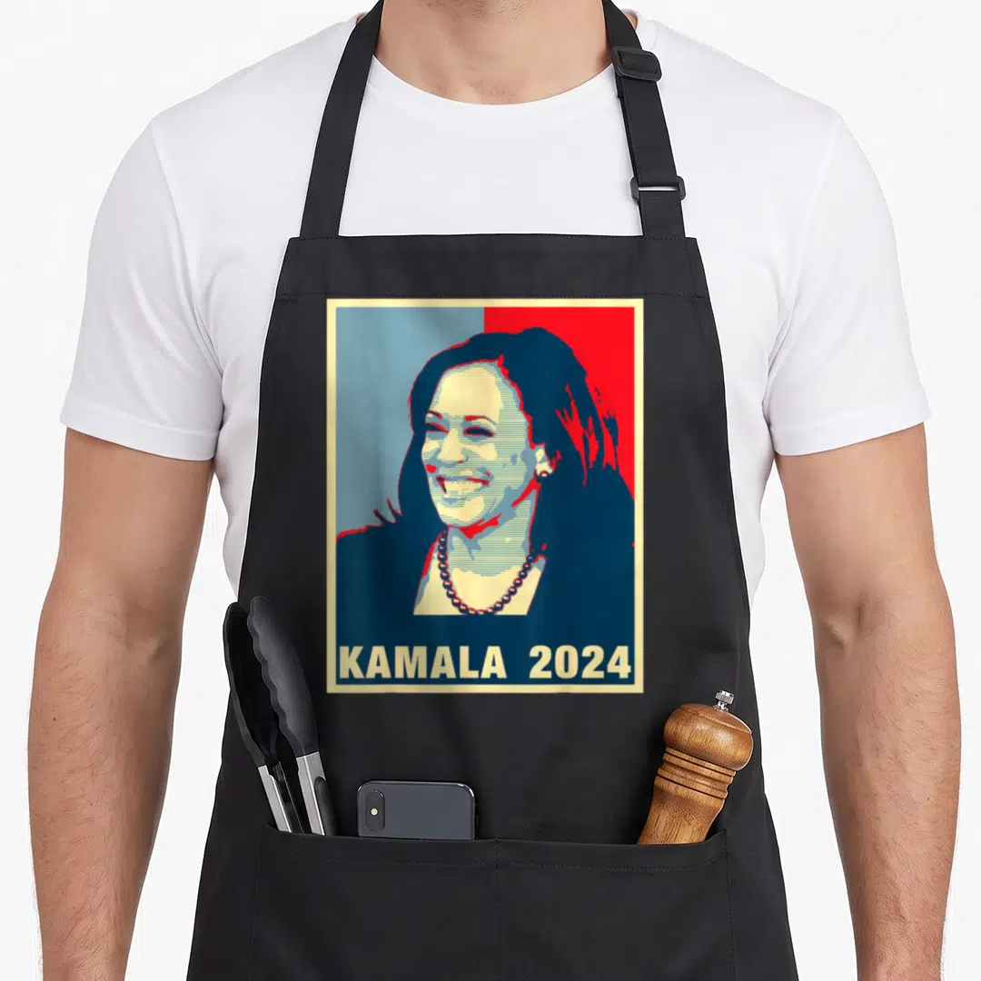 Kamala harris presidents apron - Retro portrait of Kamala Harris with KAMALA 2024 text on blue red cream background — shown on a black cotton canvas apron against a white background