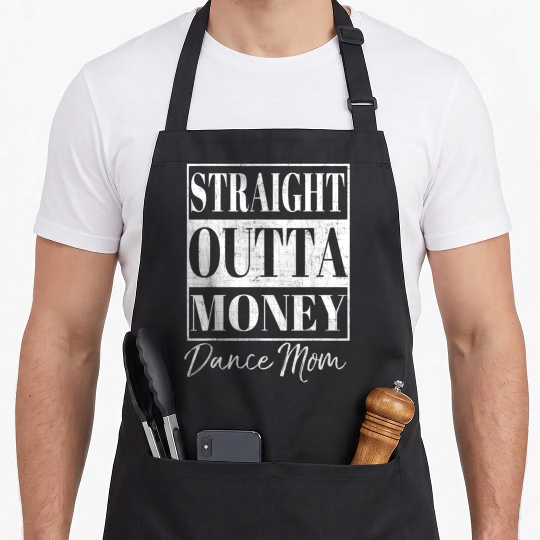 Straight money apron - White distressed typography reading STRAIGHT OUTTA MONEY Dance Mom with rectangular frames — shown on a black cotton canvas apron against a white background