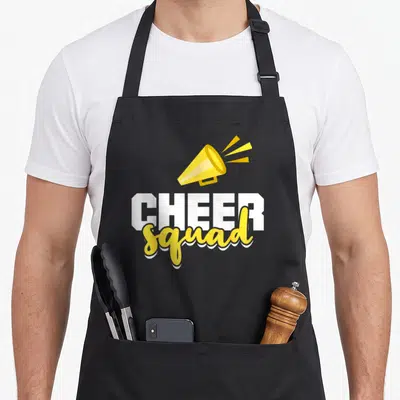 Squad cheer apron - Yellow megaphone above white CHEER and yellow squad text — shown on a black cotton canvas apron against a white background