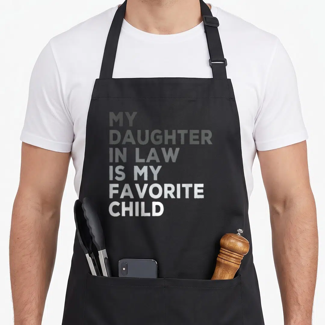 Vintage daughter father day apron - Stacked white and grey text reading My Daughter In Law Is My Favorite Child — shown on a black cotton canvas apron against a white background