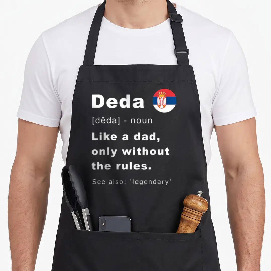 Srbija father day apron - Deda dictionary text with circular Serbian flag in red white and blue — shown on a black cotton canvas apron against a white background