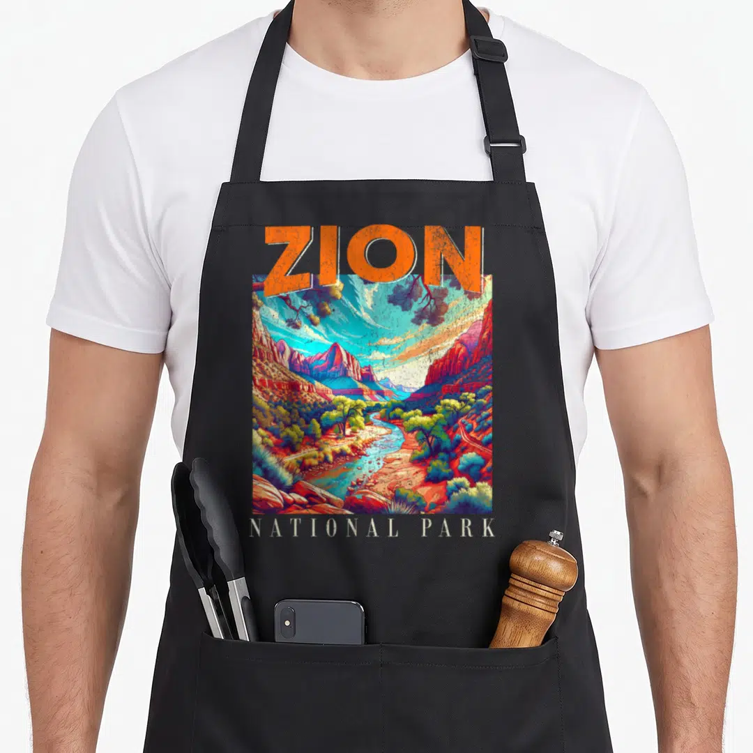 Nationalpark us aprons - Retro Zion National Park landscape with orange text and colorful canyon river art — shown on a black cotton canvas apron against a white background