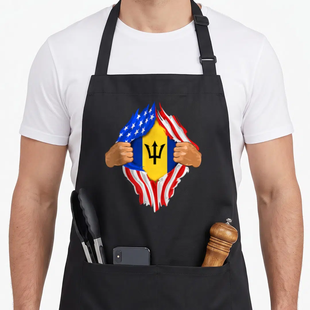 Barbadian blood apron - Two hands tearing USA flag to reveal Barbados flag with trident in blue red white yellow — shown on a black cotton canvas apron against a white background