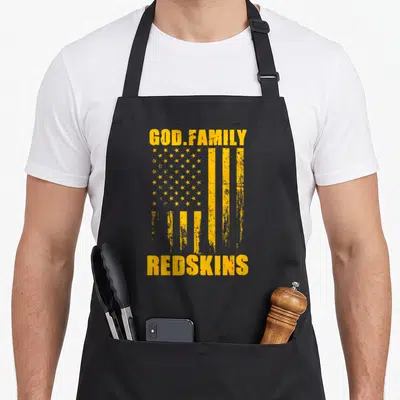 Redskin family aprons - Yellow distressed flag with GOD.FAMILY REDSKINS text stacked vertically — shown on a black cotton canvas apron against a white background