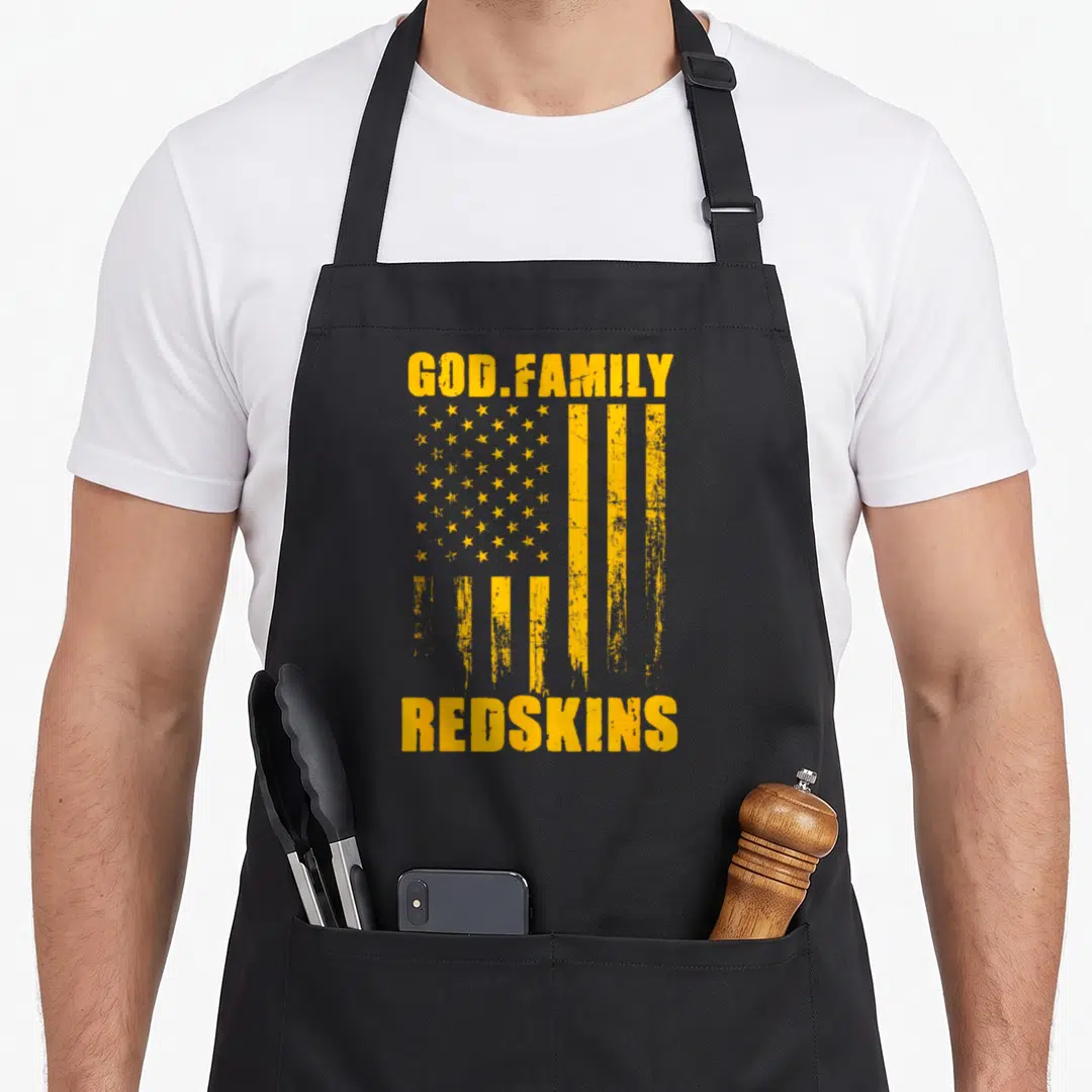 Redskin family aprons - Yellow distressed flag with GOD.FAMILY REDSKINS text stacked vertically — shown on a black cotton canvas apron against a white background