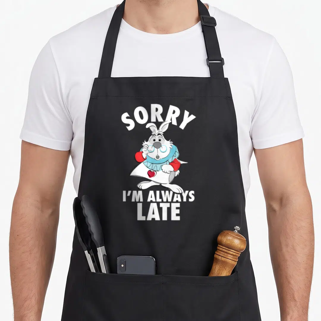 Alway alice wonderland apron - White Rabbit cartoon holding blue glasses with SORRY I'M ALWAYS LATE text — shown on a black cotton canvas apron against a white background
