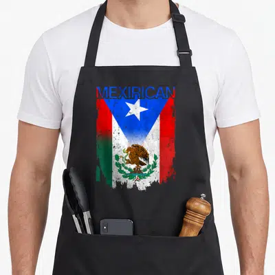 Rico mexican apron - MEXIRICAN text above a distressed flag merging Puerto Rican blue star and Mexican eagle emblem — shown on a black cotton canvas apron against a white background