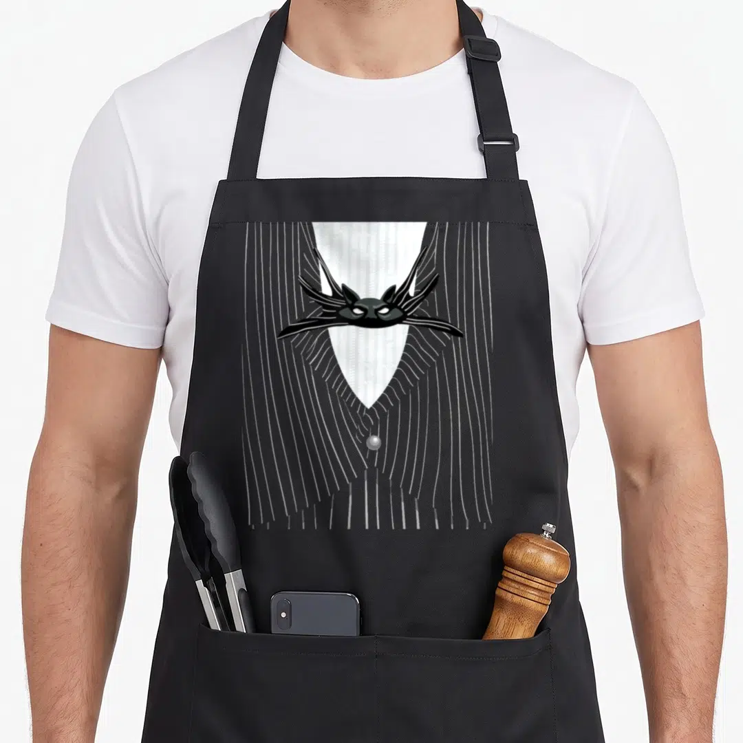 Jack blackjack apron - Black cat head mask centered on grey striped shawl with single button clasp in cartoon style — shown on a black cotton canvas apron against a white background