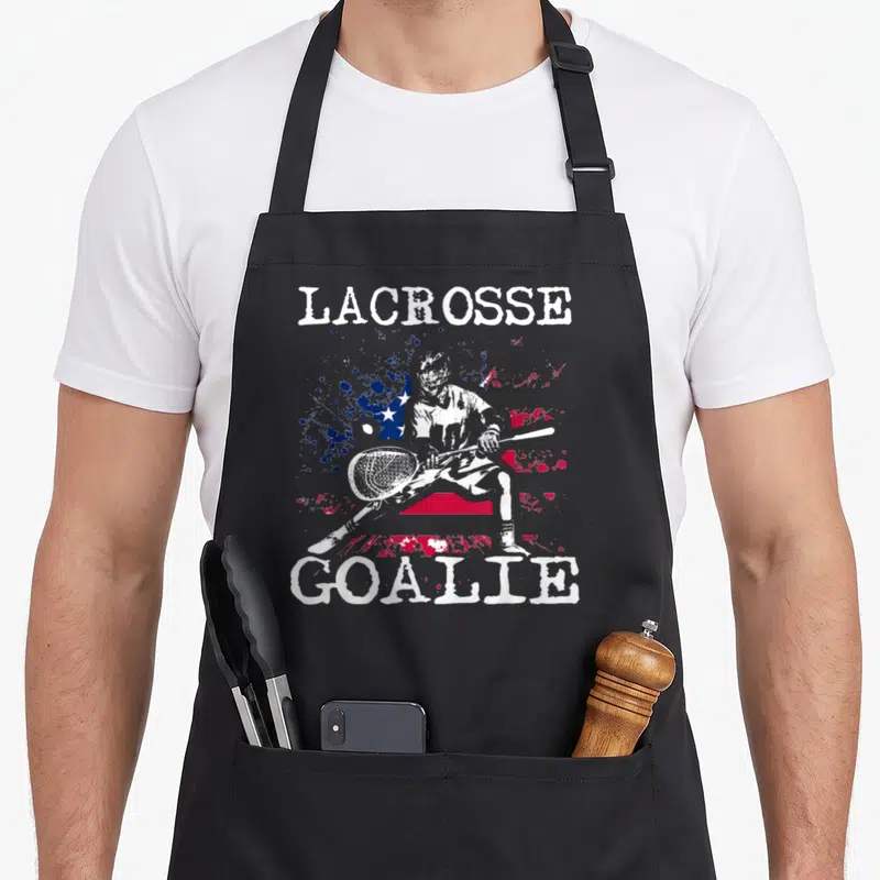 Lax goalie apron - Lacrosse goalie and distressed American flag print in white red and blue — shown on a black cotton canvas apron against a white background
