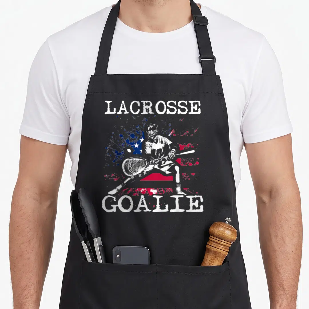 Lax goalie apron - Lacrosse goalie and distressed American flag print in white red and blue — shown on a black cotton canvas apron against a white background