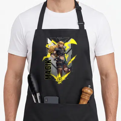 Gamerverse super hero aprons - Vertical MAGIK text next to female character with yellow energy sparks and bottom logo — shown on a black cotton canvas apron against a white background