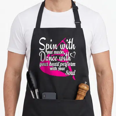 Dance winter apron - Pink ballerina silhouette with white inspirational dance quote and small heart icon — shown on a black cotton canvas apron against a white background
