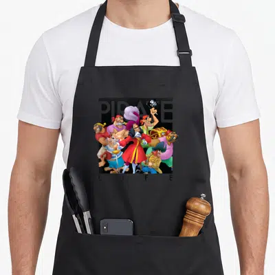 Pirate hooks for aprons - Cartoon pirate group with PIRATE LIFE text in red blue yellow black — shown on a black cotton canvas apron against a white background