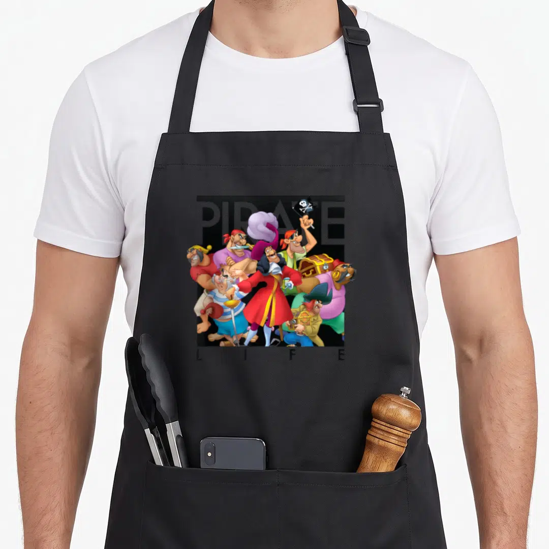 Pirate hooks for aprons - Cartoon pirate group with PIRATE LIFE text in red blue yellow black — shown on a black cotton canvas apron against a white background