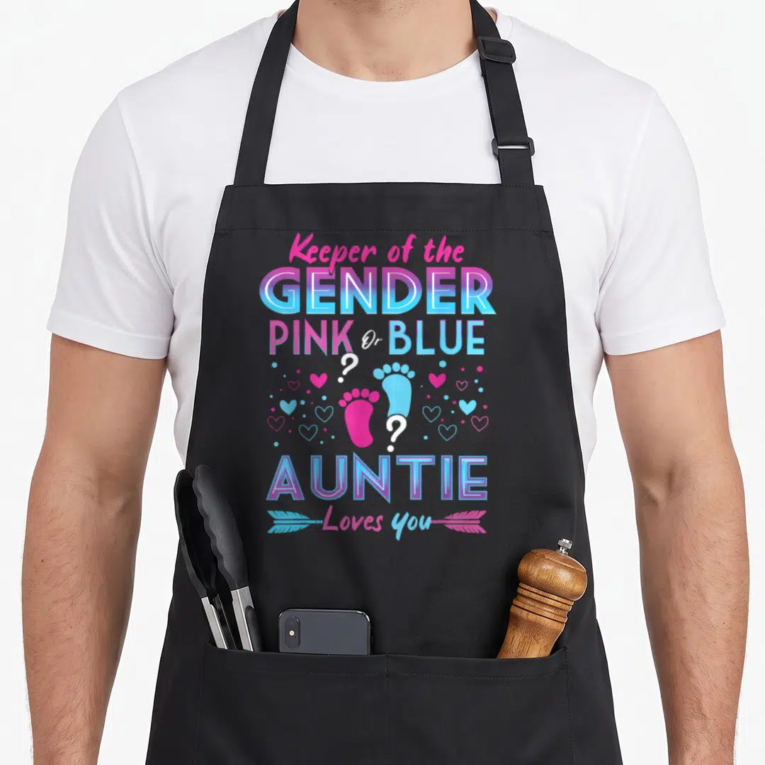 Gender blue apron or apron - Stacked pink and blue text with two baby footprints and hearts reading Keeper — shown on a black cotton canvas apron against a white background