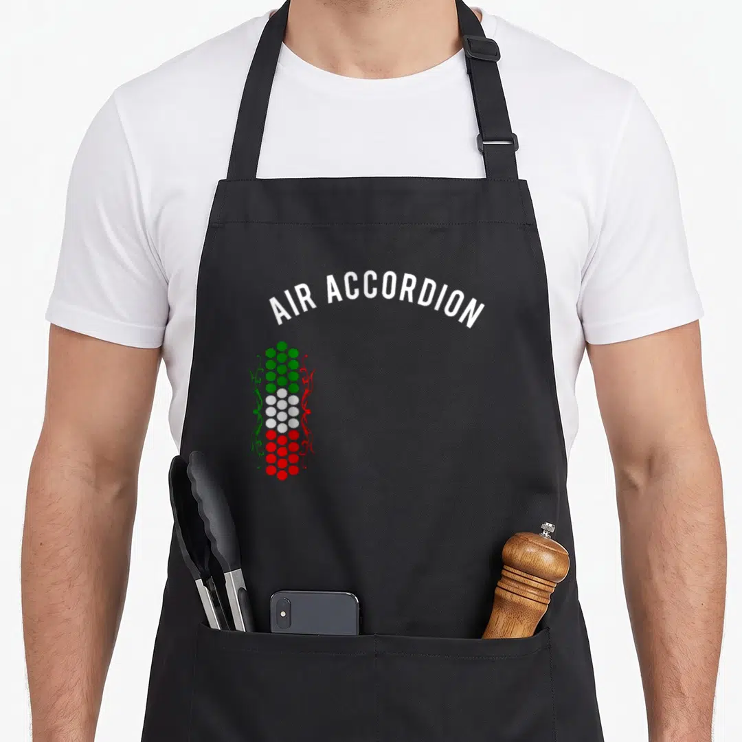 Edition mexico apron - White AIR ACCORDION text arching over green white and red button column with swirls — shown on a black cotton canvas apron against a white background