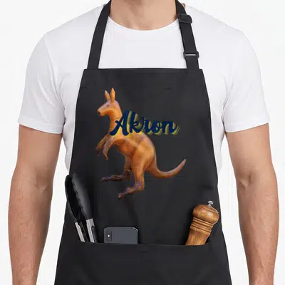 Akron kangaroo apron - Realistic brown kangaroo with dark blue Akron script across torso — shown on a black cotton canvas apron against a white background