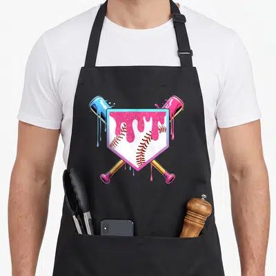 Ice drip apron - Cartoon baseball in shield with pink drip and crossed paint cans in blue and pink — shown on a black cotton canvas apron against a white background